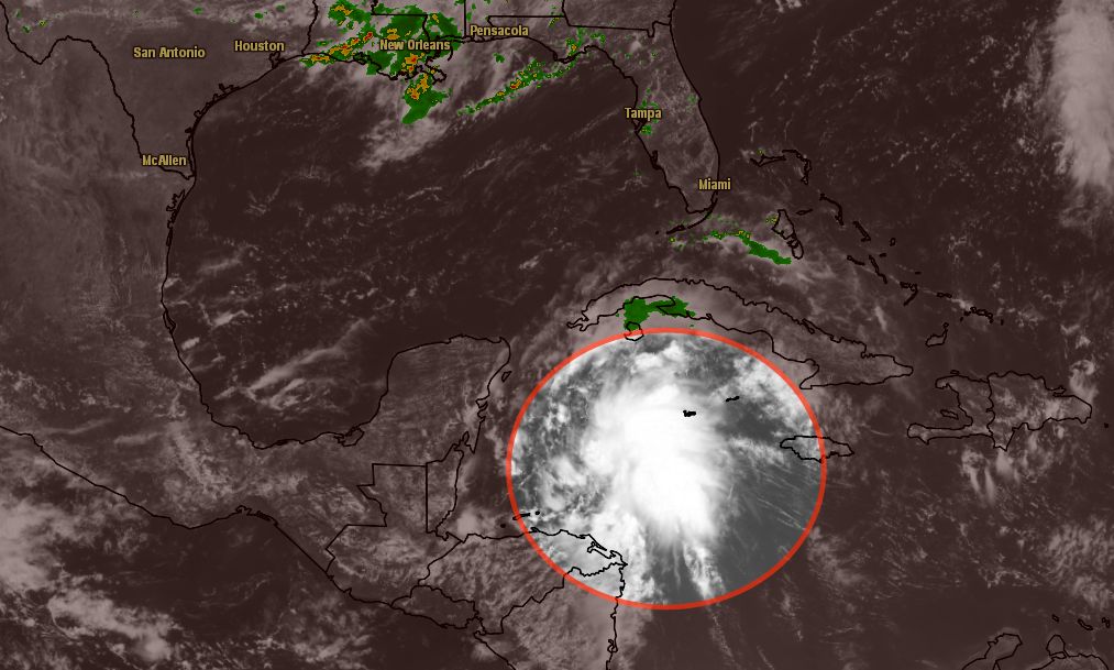 The intensifying disturbance in the northwest Caribbean Sea could move into the Gulf of Mexico as a tropical cyclone